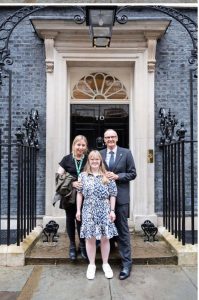 Sara Britcliffe MP, Becky Rich and Simon Rich at the black door to 10 Downing Street
