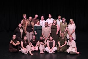 A photograph of the full cast of the show
